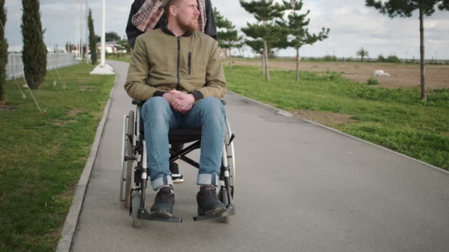 Outdoor-walk-with-disabled-husband