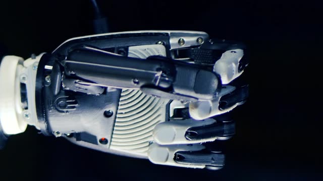 Close-up-of-a-cybernetic-hand-clenching-fingers