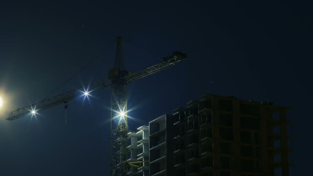 Multi-storey-House-and-a-Crane-at-Night