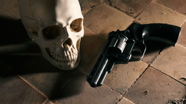 money-and-a-revolver-near-the-skull.-Criminal-concept