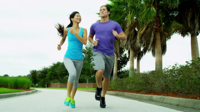 Happy-Ethnic-couple-enjoying-healthy-fitness-lifestyle-jogging