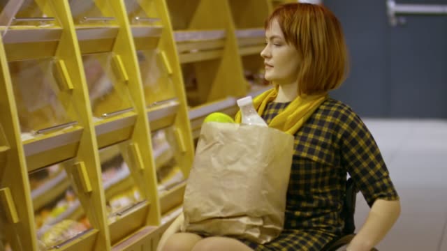 Paraplegic-Woman-Taking-Bread-in-Supermarket