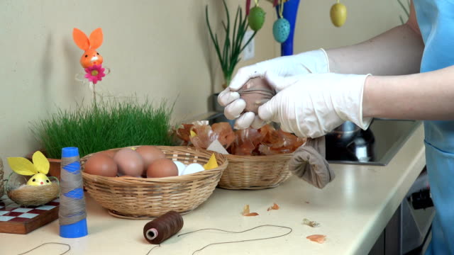 Painting-Easter-eggs-using-sock-and-onion-shell.