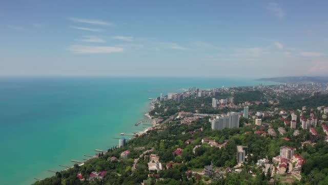 Aerial-video-shooting.-Sochi-resort-on-the-black-sea-coast.-Clear-and-blue-sky.-Residential-area.-New-houses-and-hotels.