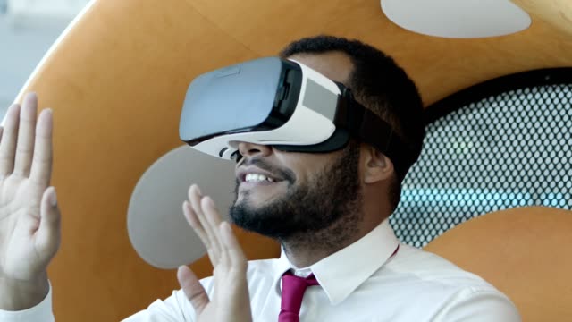 Young-businessman-in-vr-headset