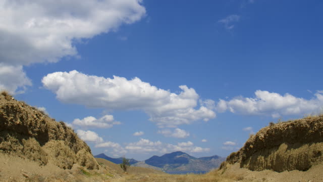 Mountainous-landscape.-Cirrus-clouds-are-running-across-the-blue-sky.