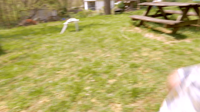 Excited-boy-running-to-get-an-easter-egg-before-another-boy-in-slow-motion