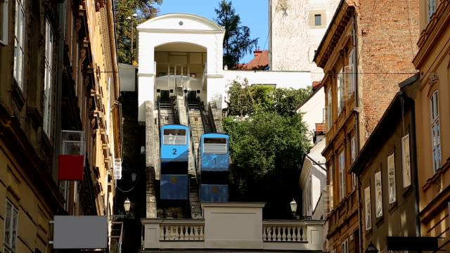 View-on-moving-cabins-of-Zagreb-funicular-from-Tomic-street,-transportation