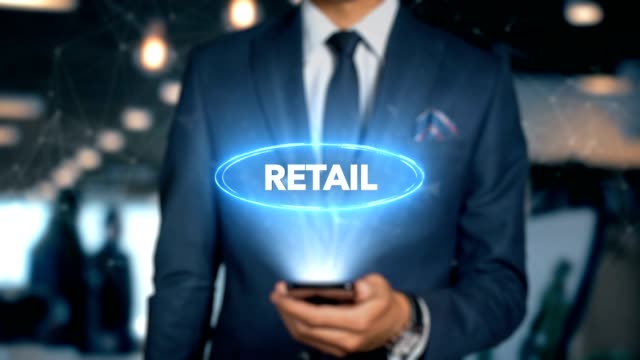 Businessman-With-Mobile-Phone-Opens-Hologram-HUD-Interface-and-Touches-Word---RETAIL