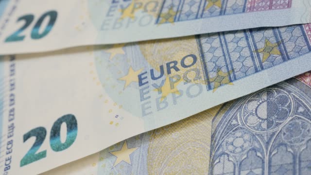 European-Union-20-denominations-banknote-background-close-up-4K-2160p-30fps-UltraHD-tilting-footage---Lot-of-twenty-Euros-in-a-row-slow-tilt-4K-3840X2160-UHD-video