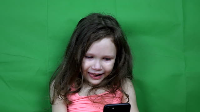 Little-girl-watching-video-on-a-smartphone
