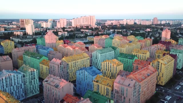 Flying-over-cozy-comfortable-colorful-buildings-in-a-European-city,-aerial-survey
