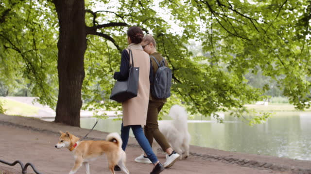 Female-Dog-Owners-Walking