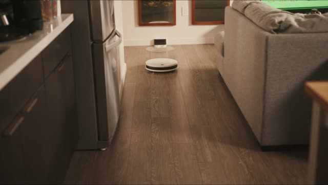 Robotic-vacuum-cleaner-rides-around-apartments-and-cleans-result-of-a-party
