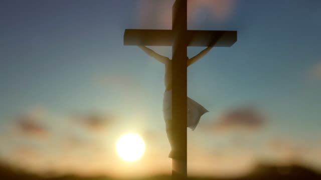 Jesús-cruz-contra-amanecer-borroso,-panorámica
