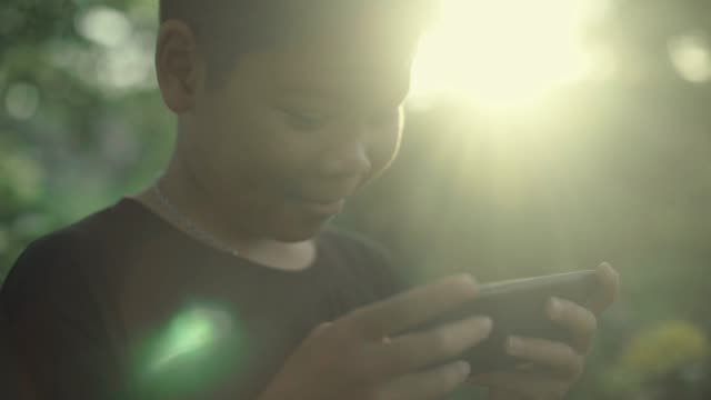Boy-using-smartphone