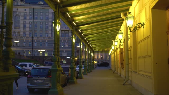Bolshoi-Theater,-Moscow,-Russia.-Walking-along-the-aisle-with-columns-at-night