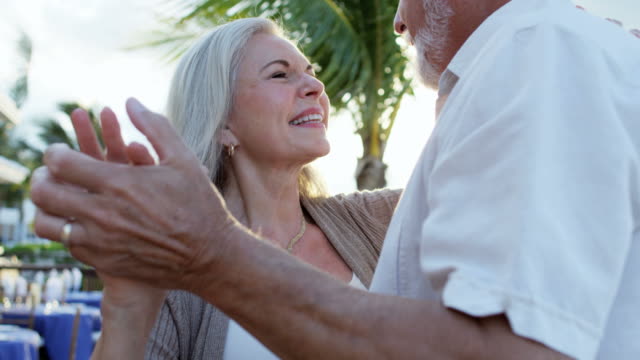 Retired-Caucasian-couple-evening-dancing-at-vacation-hotel