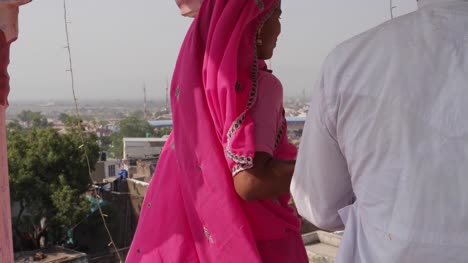 Close-up-of-a-couple's-hands-to-them-walking-upto-a-view-point-in-Pushkar,-Rajasthan,-India