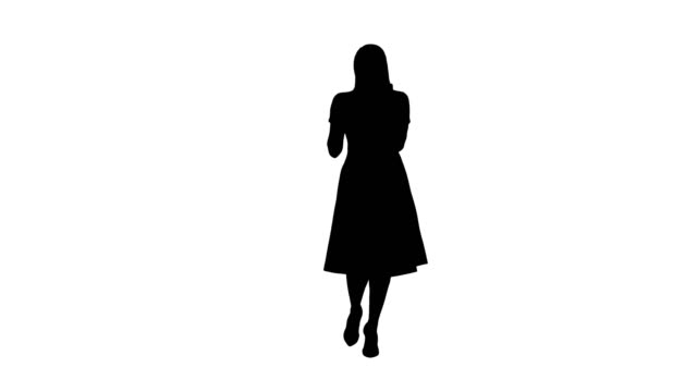 Silhouette-Smiling-woman-in-pink-dress-doing-making-video-call-and-walking