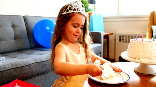Girl-having-cake-at-home