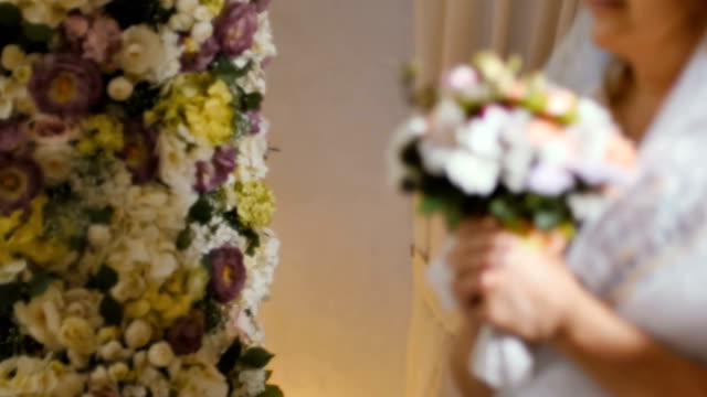 Bride-with-wedding-bouquet-of-flowers