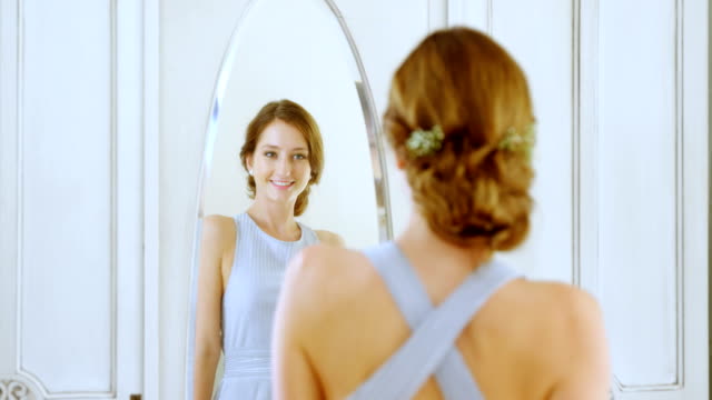 Gorgeous-bride-checking-herself-in-the-mirror-4K-4k