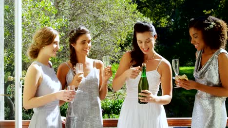Happy-Bride-trying-to-open-champagne-bottle-4K-4k