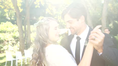 Happy-young-bride-and-groom-hugging-each-other-while-dancing-4K-4k