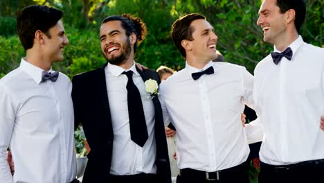 Groom-and-groomsmen-happily-posing-4K-4k