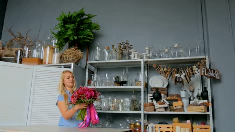 3-shots.-Professional-florist-holding-and-checking-bouquet-at-studio