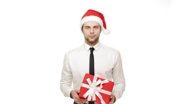 4k-Businessman-giving-present-to-camera-over-isolated-white-background.