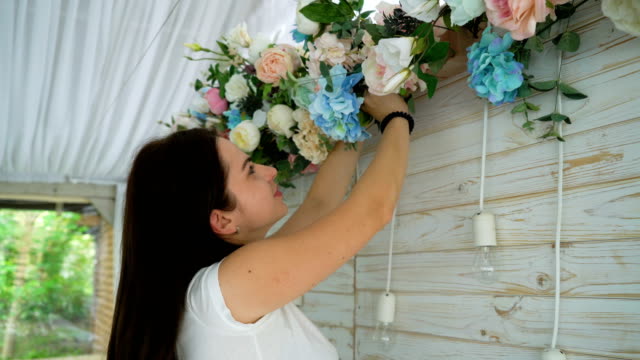 Closeup-beautiful-florist-creating-spring-colorful-bouquet-arrangement