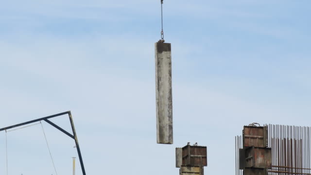 Crane-depositing-a-module-of-a-building-under-construction