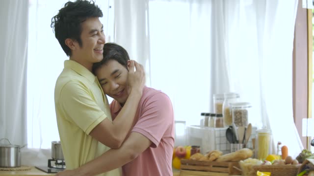Portrait-of-young-asian-gay-couple-posing-together-at-home.