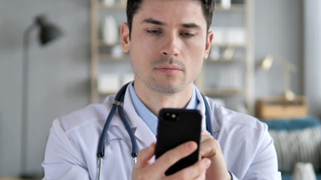 Doctor-Using-Smartphone-for-Internet