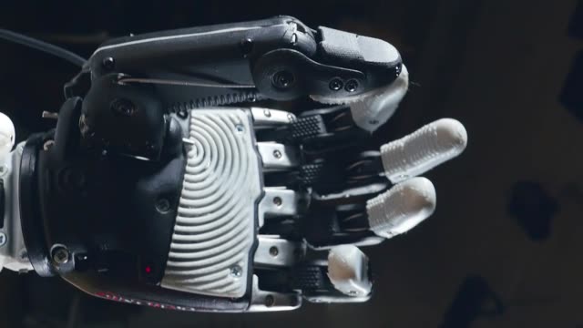 Artificial-intelligence-concept.-Cyborg-hand-moves-fingers,-robotic-equipment.
