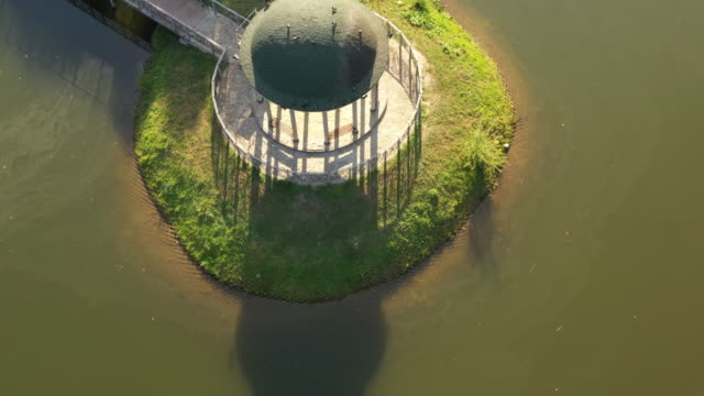 Theophania-Park,-a-gazebo-on-a-small-island-in-the-middle-of-the-lake,-top-view,-drone-flight