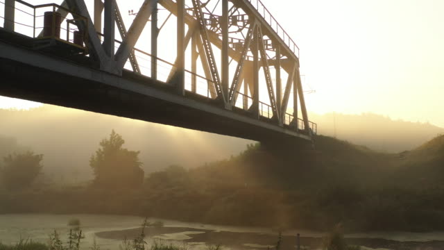 Iron-railway-bridge-at-dawn-in-the-fog