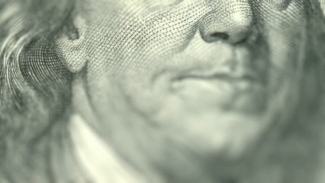 100-USD-dollar-cash---stop-motion-animation.-USA-money.-macro-view.-Hundred-Dollar-close-up