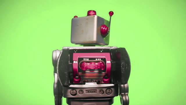 un-robot-retro-con-una-cabeza-giratoria-a-la-izquierda-y-luego-a-la-derecha