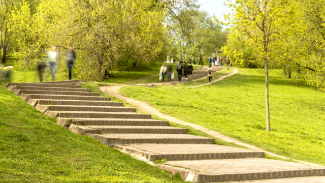 people-walk-the-stairs-in-the-city-Park-in-spring-day,-time-lapse