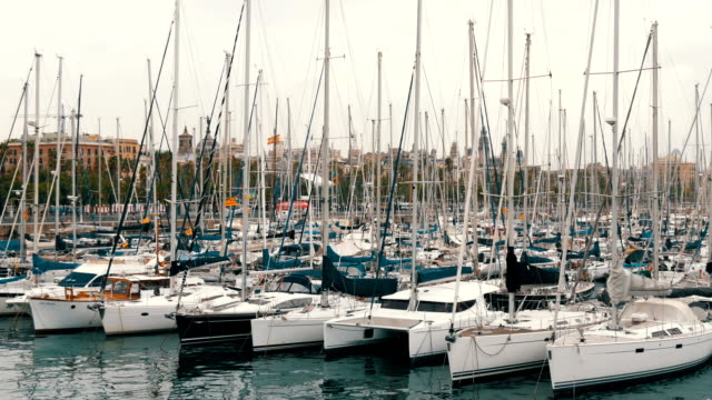 Part-of-beautiful-white-stylish-yacht-moored-in-a-harbor-or-bay-in-Barcelona