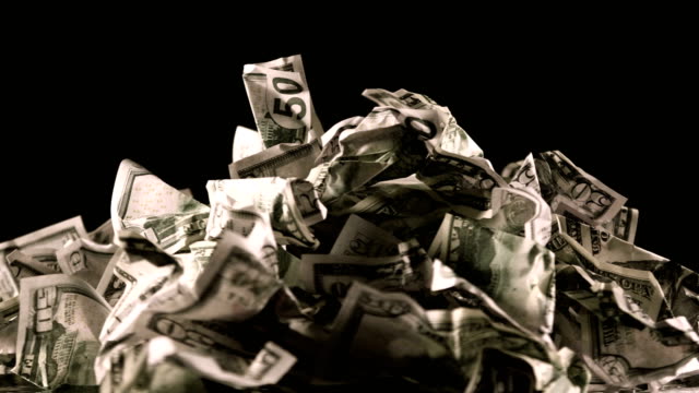 A-bunch-of-crumpled-fifty-dollar-bills-rotate