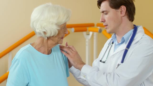 Physiotherapist-Examining-Elderly-Woman