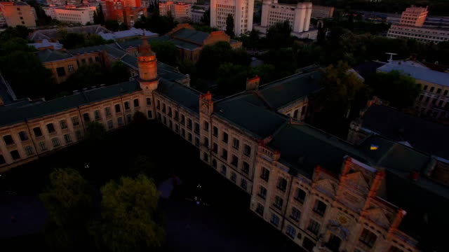 Old-university-on-the-background-of-the-city-at-sunset-aerial