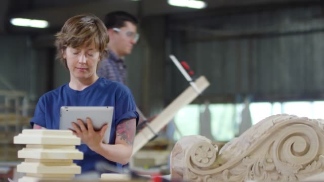 Woman-Working-on-Tablet-in-Joinery