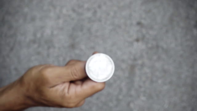 slowmotion-shot-tossing-coin-to-flip-on-heads-or-tails