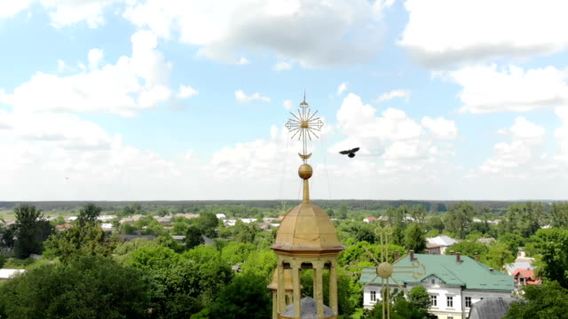 Flying-over-the-dome-of-the-Church.-The-bird-sits-on-the-cross-of-the-Church