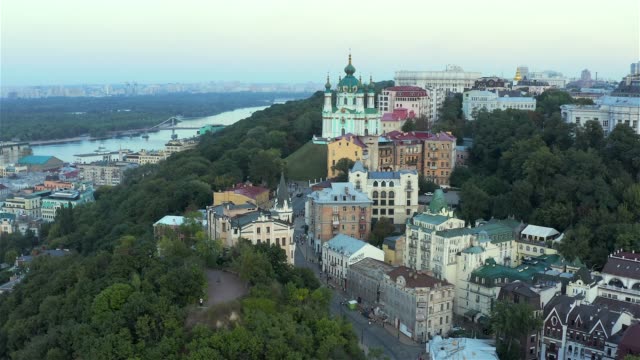 Aerial-view-of-St.-Andrew's-Church,-Richard's-Castle-and-the-famous-St.-Andrew's-Descent,-where-artists-exhibited-their-work,-Podil,-Kyiv
